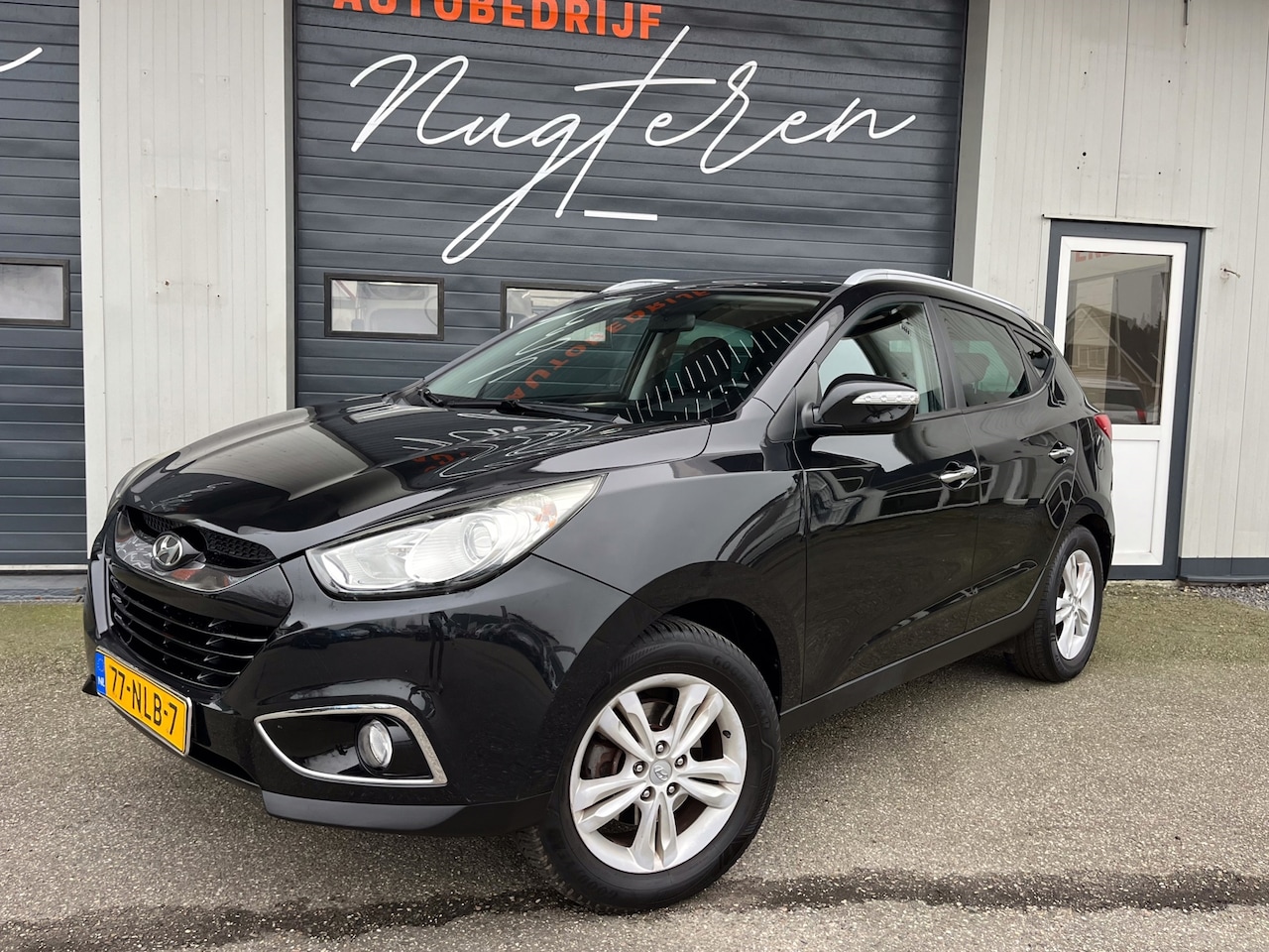 Hyundai ix35 - 2.0i Style+Clima+Trekhaak+Half leer - AutoWereld.nl