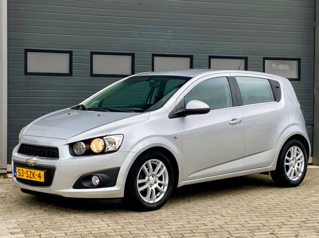 Chevrolet Aveo - 1.4 LTZ 101PK 5-Drs Airco Cruise Pdc Rijklaar! - AutoWereld.nl