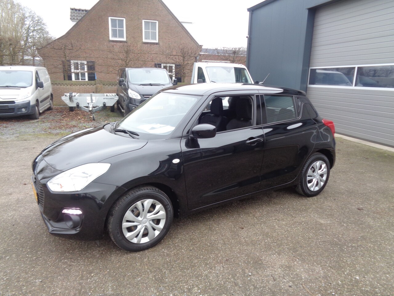 Suzuki Swift - 1.2 Comfort airco, bluetooth, metallic lak - AutoWereld.nl