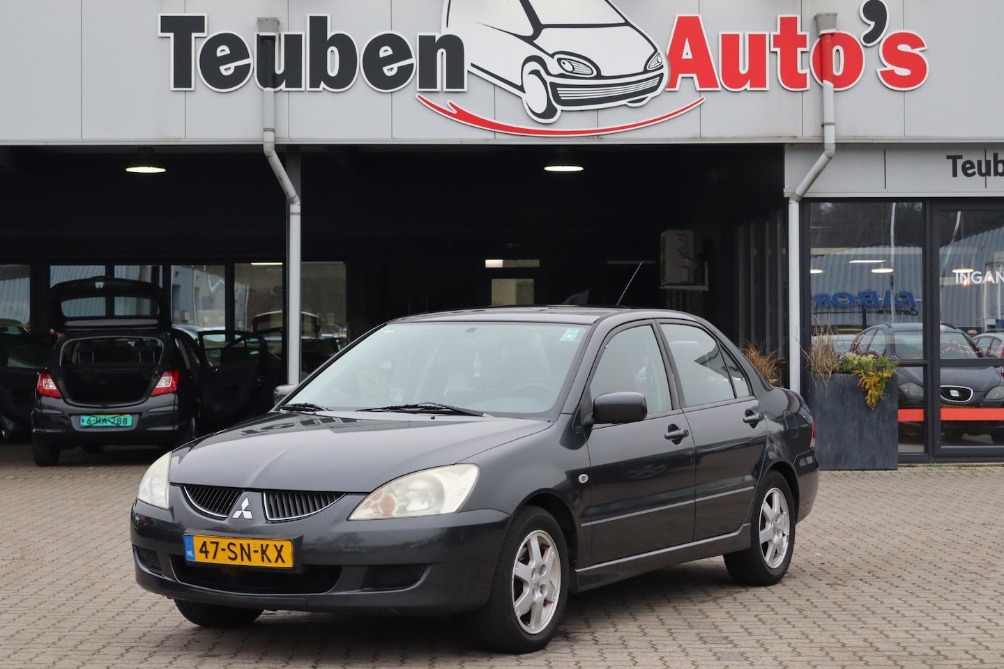 Mitsubishi Lancer - 1.6 Comfort Airco, Elektrische ramen, Radio cd speler - AutoWereld.nl