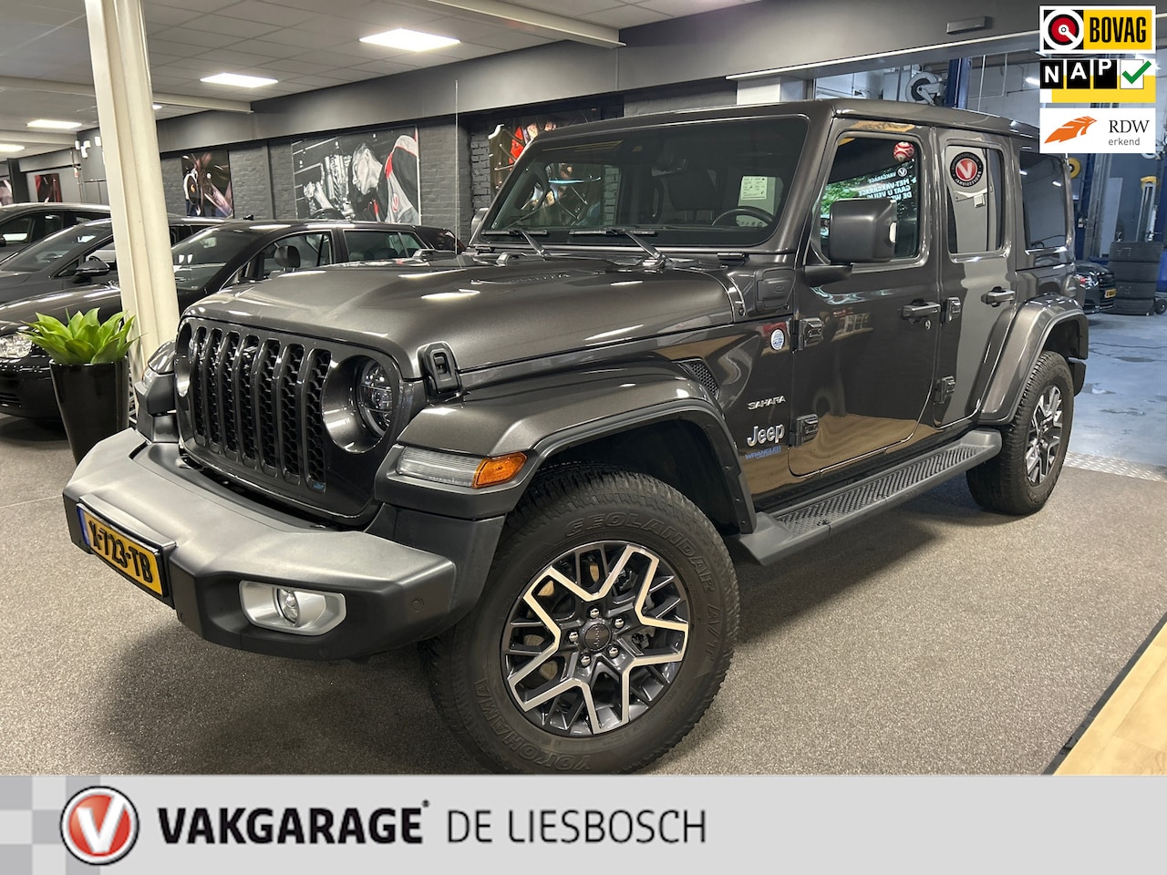 Jeep Wrangler Unlimited - 4xe 380 Sahara 4xe 380 Sahara,cabrio dak,leer,navi,camera,PHEV,alpine audio - AutoWereld.nl