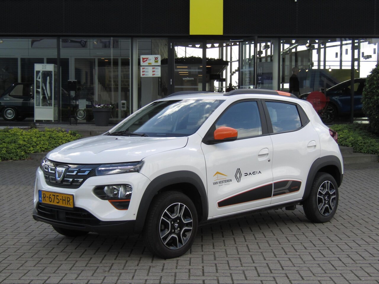 Dacia Spring - Electric Comfort Plus Orange Pack / Navigatie / Camera / Leder / DC Lader - AutoWereld.nl