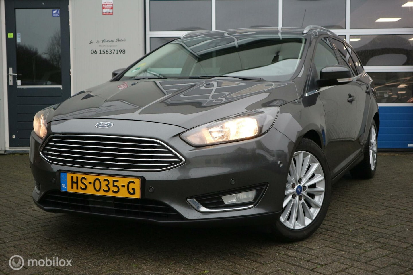 Ford Focus Wagon - 1.5 TDCI Titanium Edition AIRCO-ECC/NAVI - AutoWereld.nl