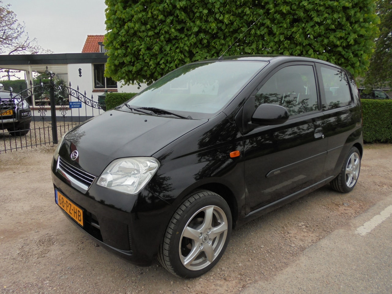 Daihatsu Cuore - 1.0-12V Nagano Sport **AIRCO**LM-VELGEN**TREKHAAK** - AutoWereld.nl