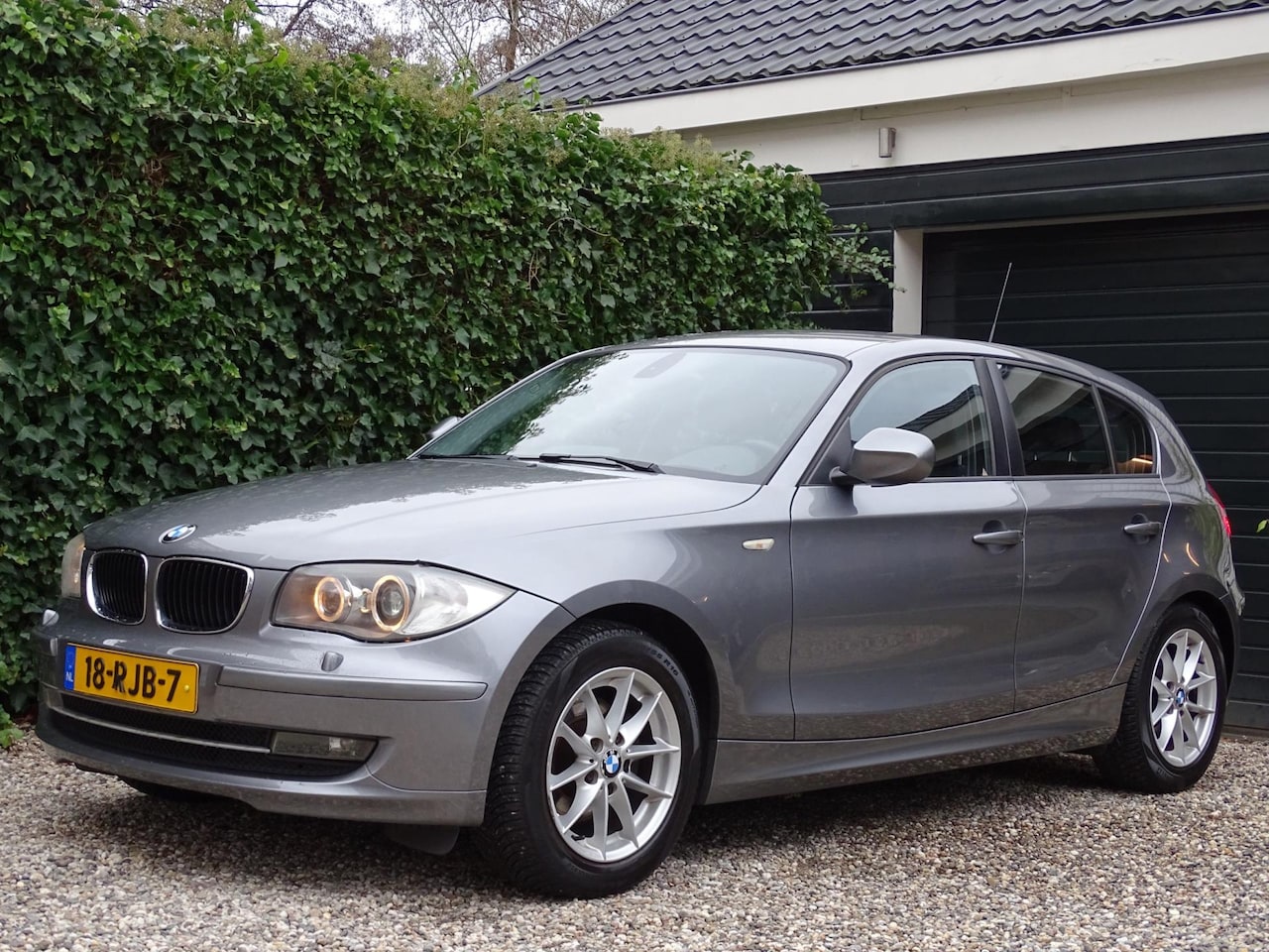 BMW 1-serie - 118i Business Line Ultimate Edition | Automaat | Leer | Navigatie | Xenon - AutoWereld.nl