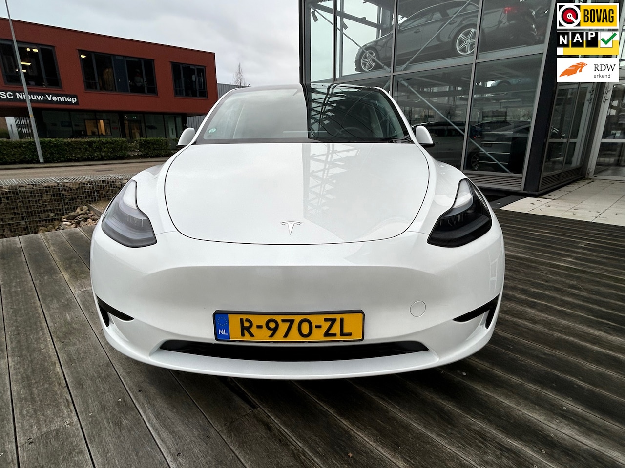 Tesla Model Y - RWD 58 kWh Panoramadak, 20inch velgen - AutoWereld.nl