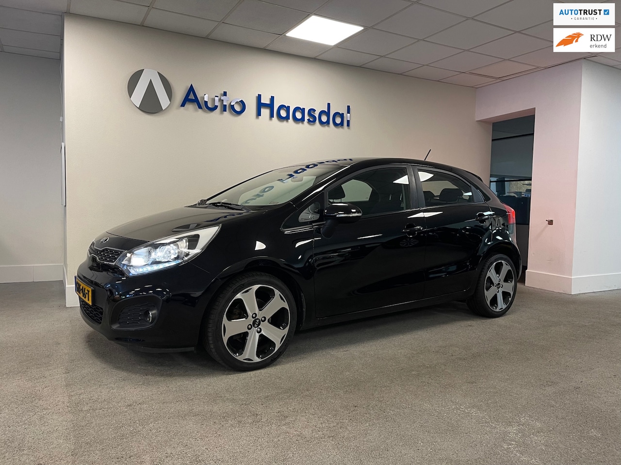 Kia Rio - 1.4 CVVT Super Pack|109PK|117.100km|LED|CRUISE|NAVI|17" - AutoWereld.nl