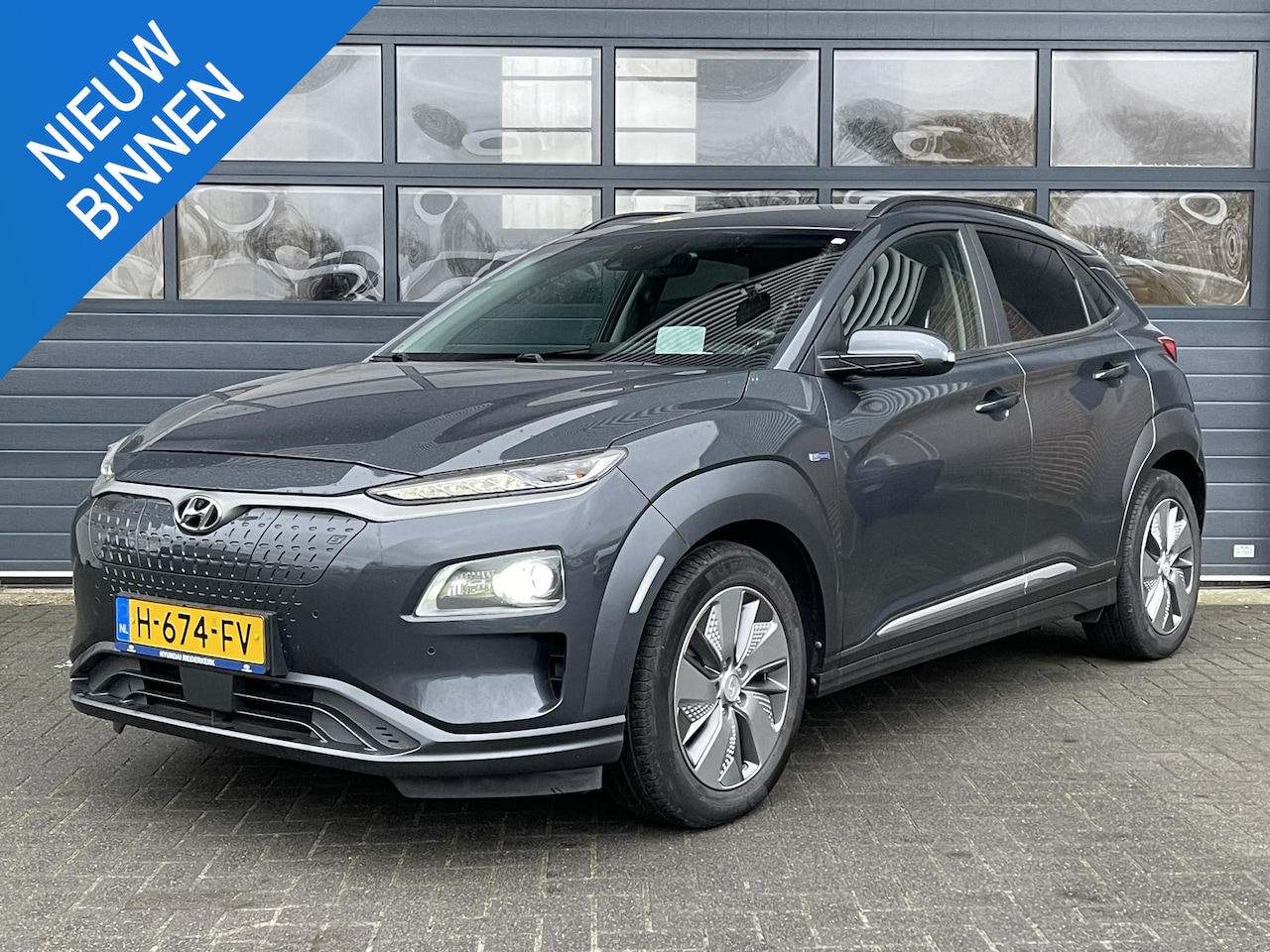 Hyundai Kona Electric - EV PREMIUM 64 KWH I APPLE/ANDROID I PARKEERCAMERA I CLIMATE CONTROL I CRUISE CONTROL - AutoWereld.nl