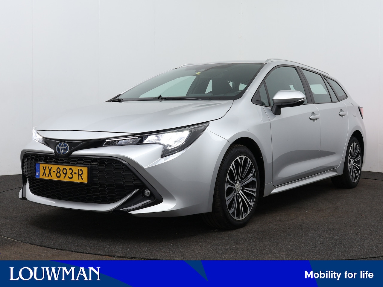 Toyota Corolla Touring Sports - 1.8 Hybrid First Edition | Adaptive Cruise Control | Navigatie | Camera | LM velgen | Clim - AutoWereld.nl