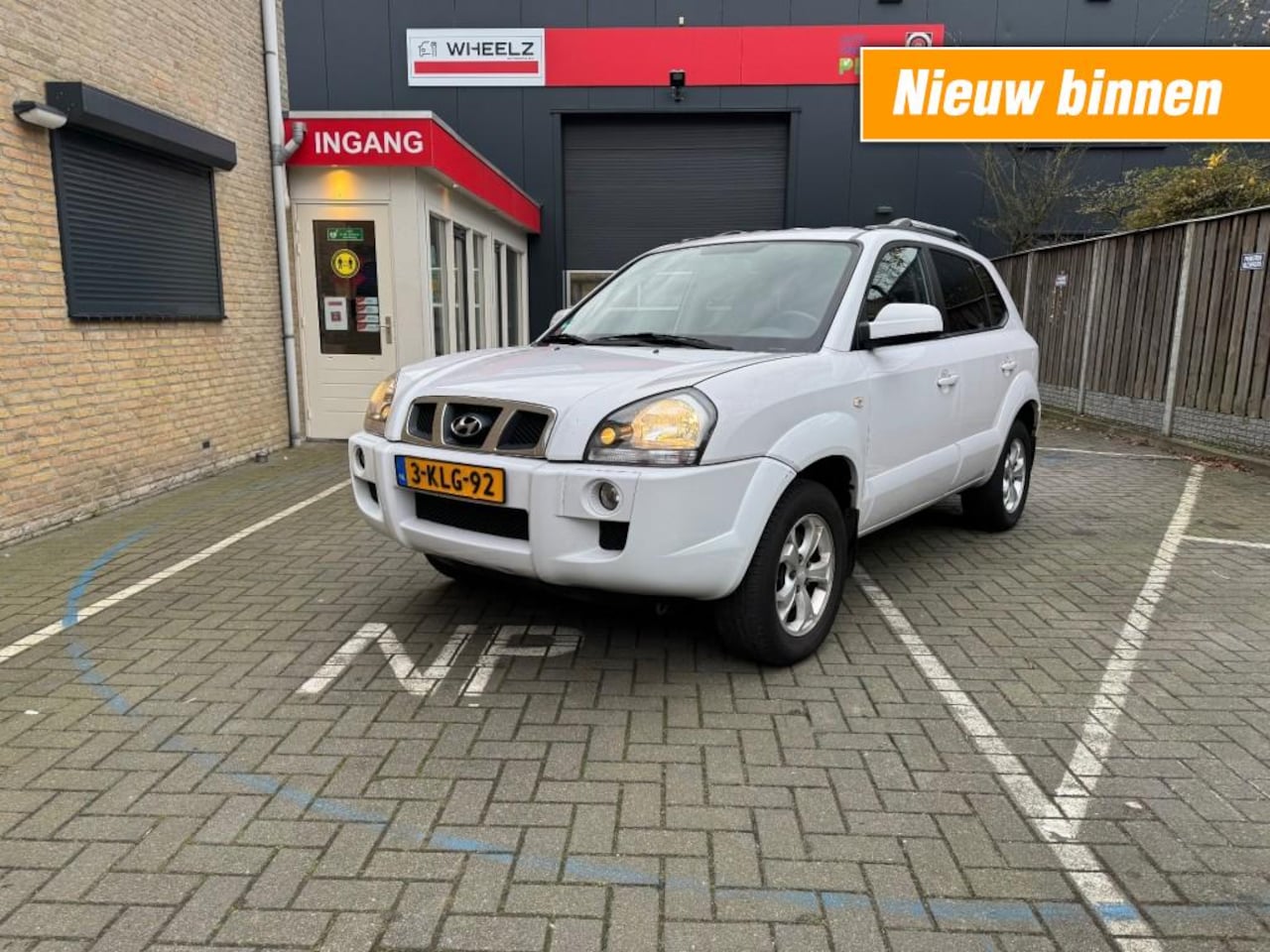 Hyundai Tucson - 2.0 executive - lpg 3 - ecc - leder - AutoWereld.nl