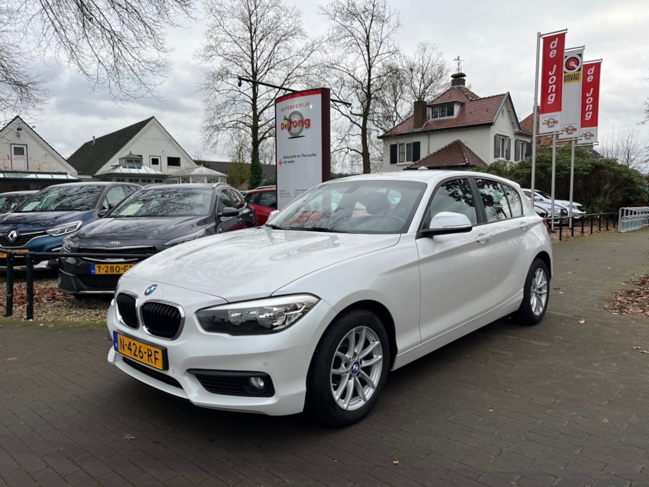 BMW 1-serie - 118I SPORT / STOELVERW. / CRUISE CTR. / AIRCO-ECC / PDC - AutoWereld.nl