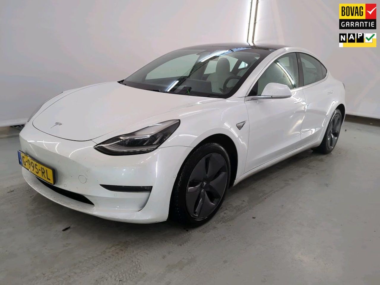 Tesla Model 3 - Long Range RWD Long Range AWD 75 kWh WIT LEER / TREKHAAK / AUTOPILOT - AutoWereld.nl