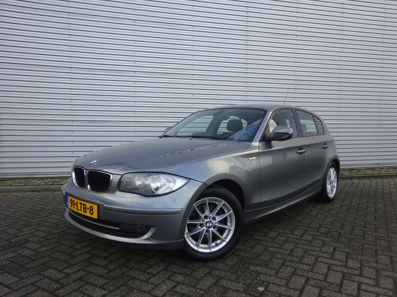 BMW 1-serie - 116i Business Line / 1e Eigenaar / Climate control / Navi / Lm velgen / NAP - AutoWereld.nl