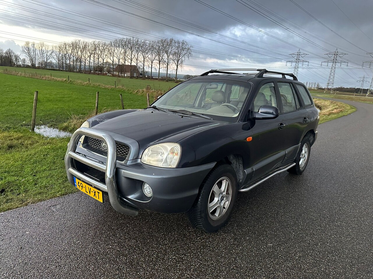 Hyundai Santa Fe - 2.4i-16V 4WD Navy 4WD / AIRCO / NAP ! - AutoWereld.nl