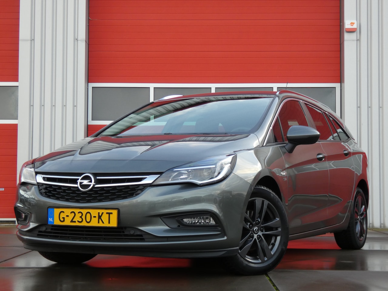 Opel Astra Sports Tourer - 1.4 Turbo 120 Jaar Edition/ automaat/ unieke km! - AutoWereld.nl