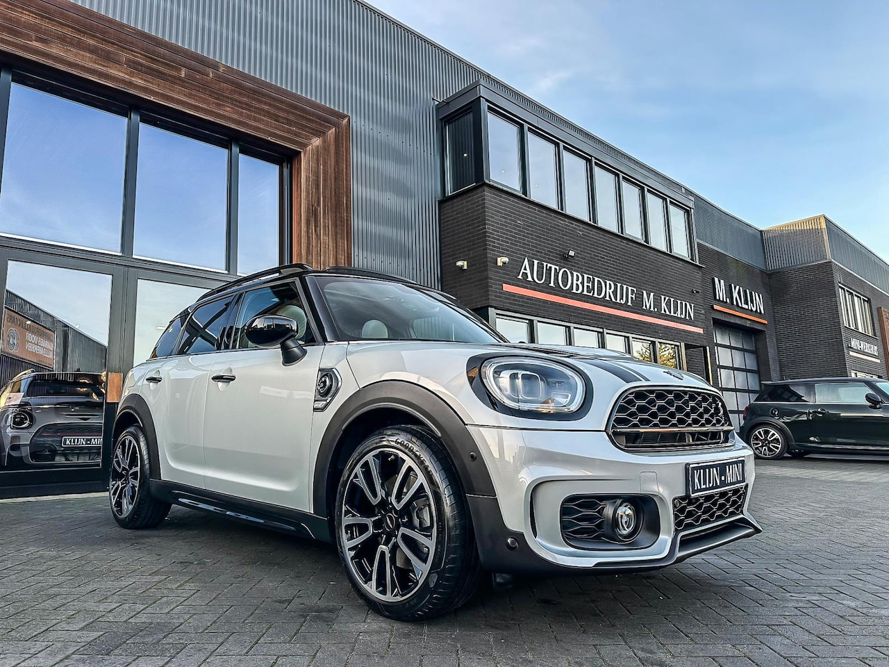 MINI Countryman - Mini 2.0 Cooper S E ALL4 John Cooper Works 220pk/Chester leer/pano/camera/19.000km - AutoWereld.nl