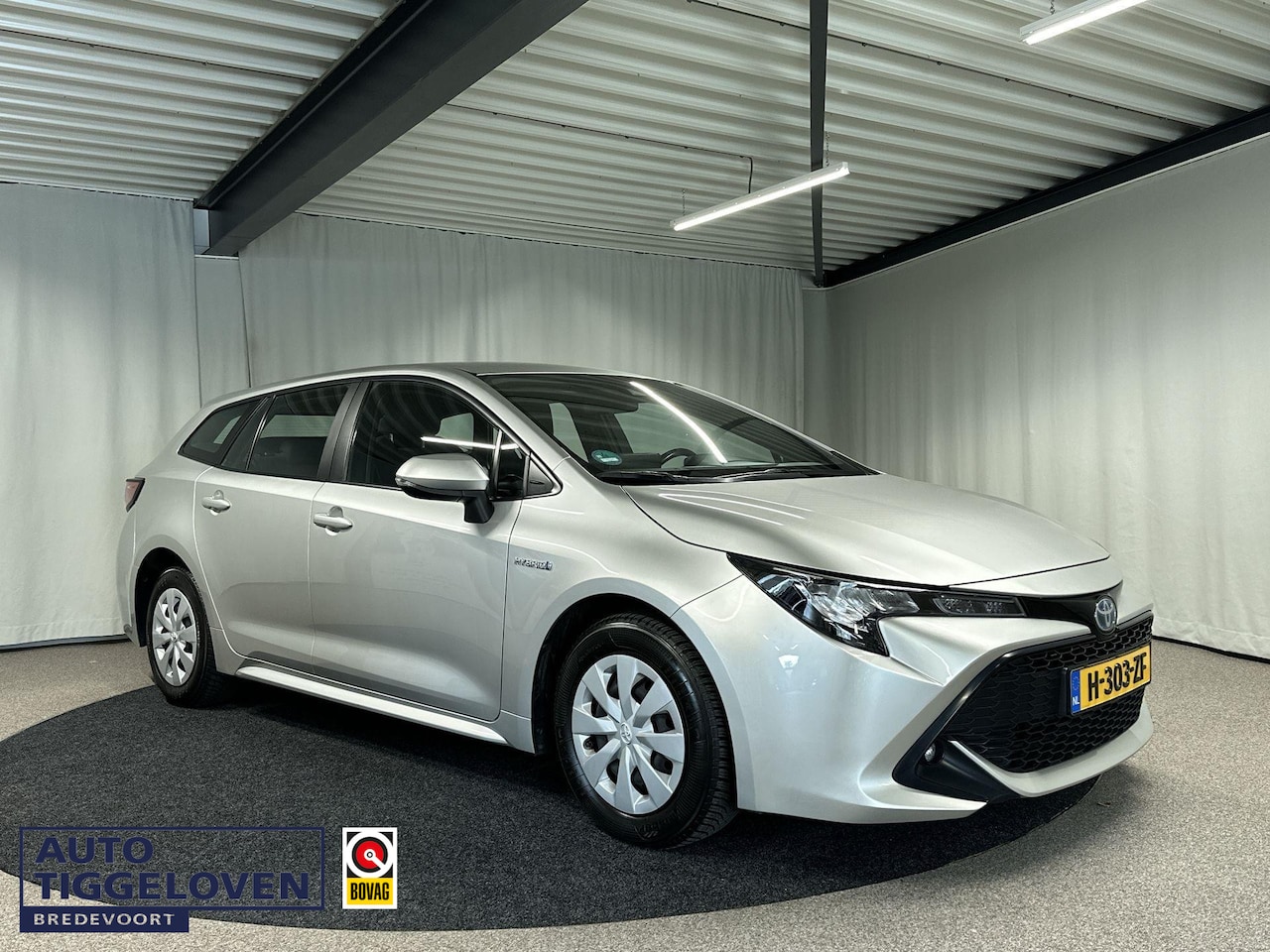 Toyota Corolla Touring Sports - 1.8 Hybrid Active NAV-BY-APP|TREKHAAK - AutoWereld.nl