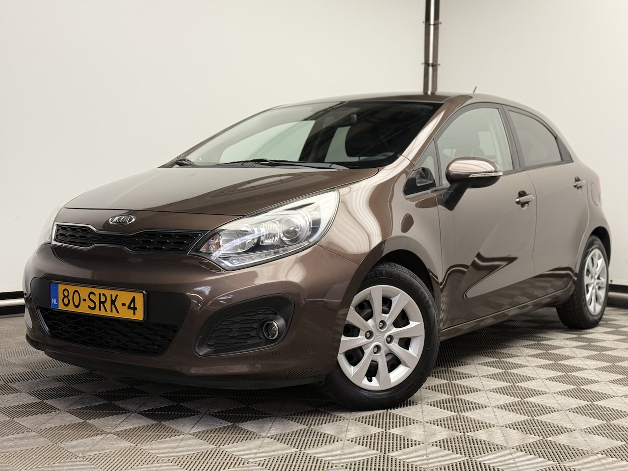 Kia Rio - 1.2 CVVT Plus Pack 5-drs Airco 1e Eigenaar - AutoWereld.nl