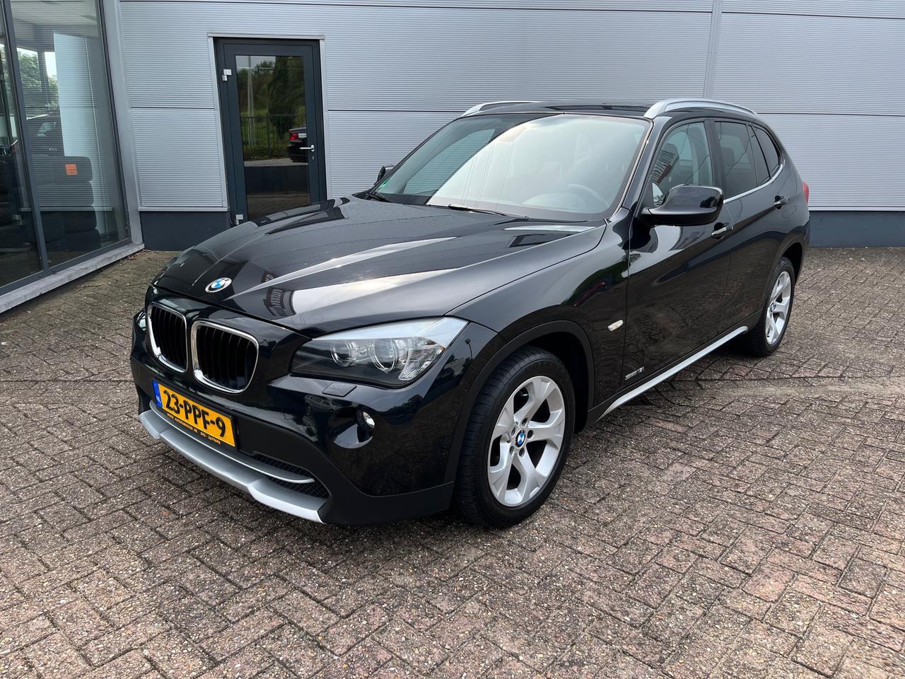 BMW X1 - 2.0 SDRIVE 18I | LEER | XENON | PANO | NAVI - AutoWereld.nl