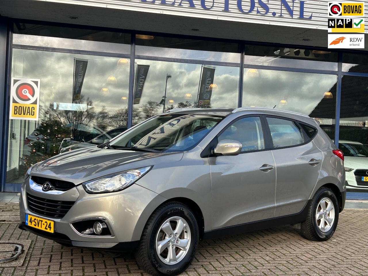 Hyundai ix35 - 2.0i Business Edition Aut. Half Leer Clima Cruise Park.Sens Trekhaak Dealeronderhouden! - AutoWereld.nl