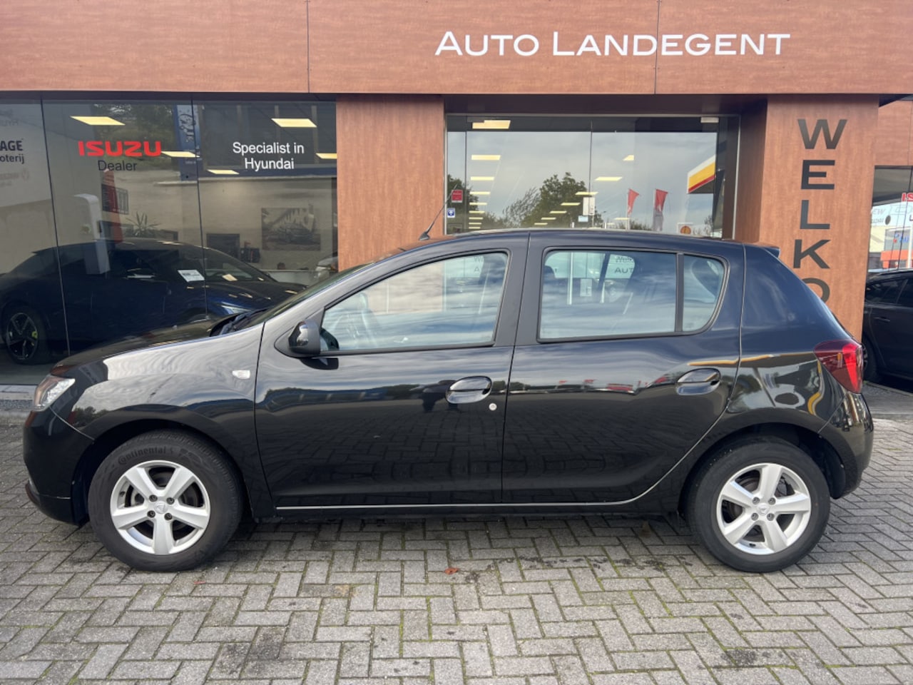 Dacia Sandero - 1.0 TCe SL Royaal - Airco | Bluetooth | Cruise C. | Radio-/MP3 | Parks. Achter - AutoWereld.nl