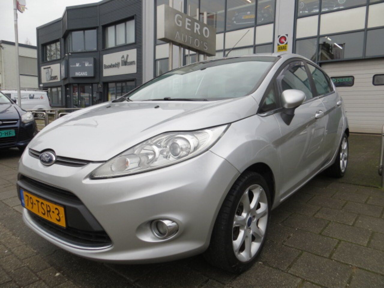 Ford Fiesta - 1.25 Titanium 5drs leder ,airco ecc,pdc 16 inch etc - AutoWereld.nl