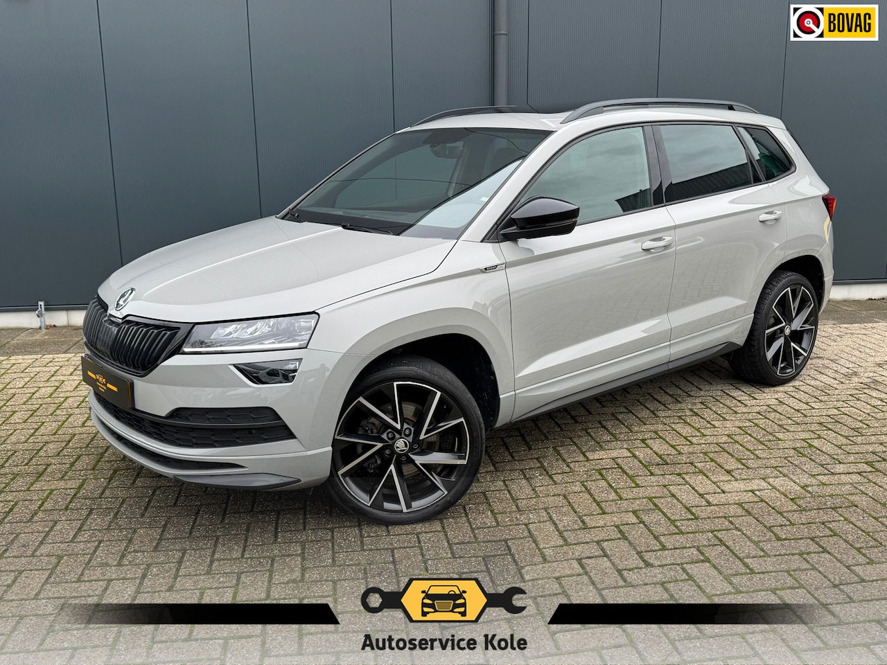 Skoda Karoq - 1.5 TSI ACT Sportline Business * El. Panoramadak * Cruise * Dode hoek detectie * - AutoWereld.nl