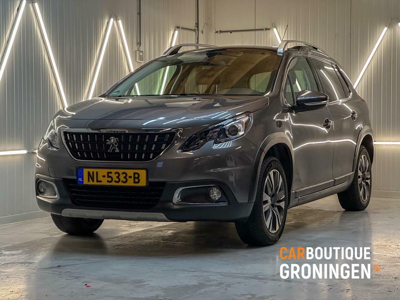 Peugeot 2008 - 1.2 PureTech Blue Lion | PANORAMA | LEER | TREKHK - AutoWereld.nl