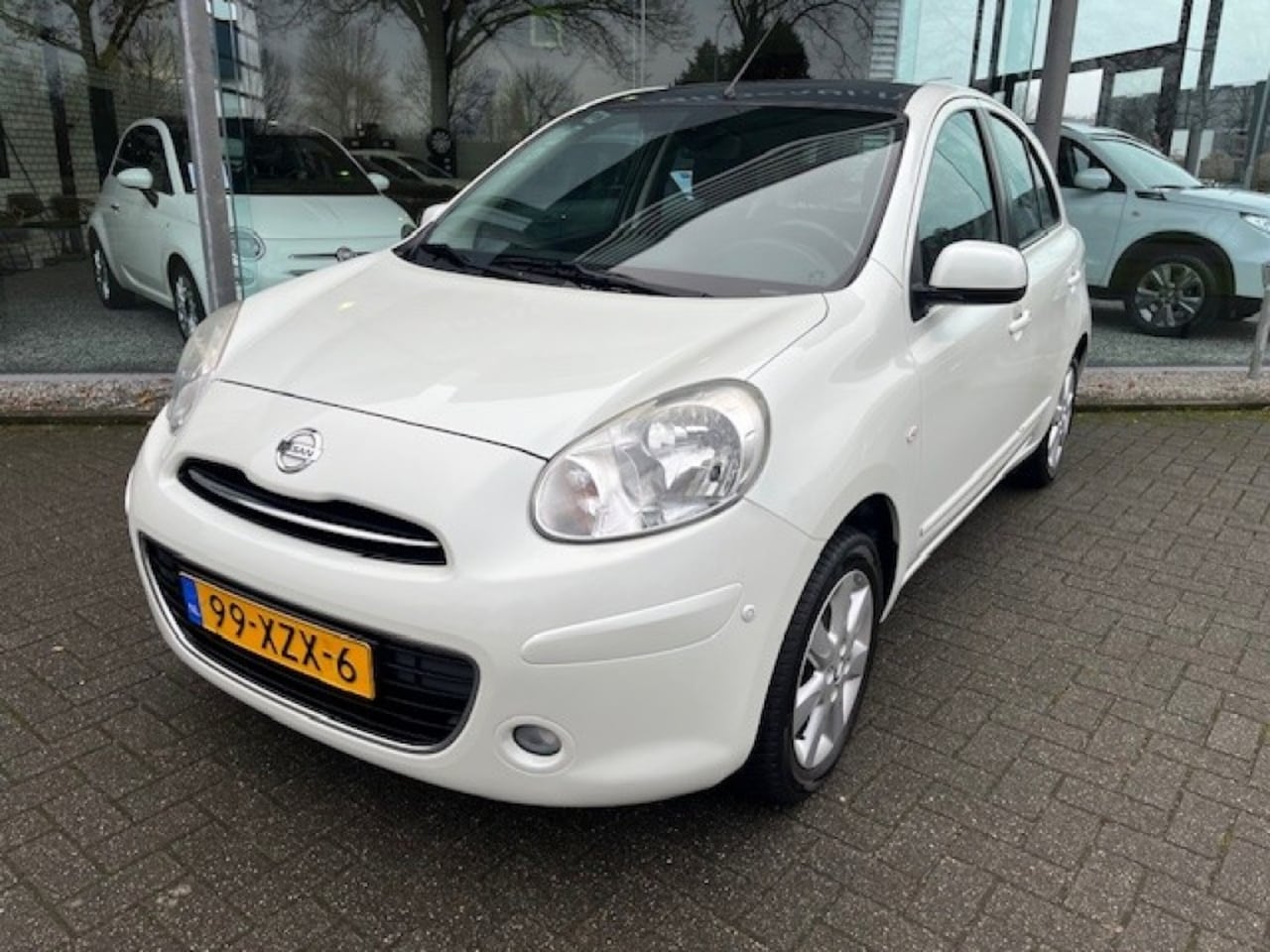 Nissan Micra - 1.2 Tekna Clima Cruise Navi - AutoWereld.nl