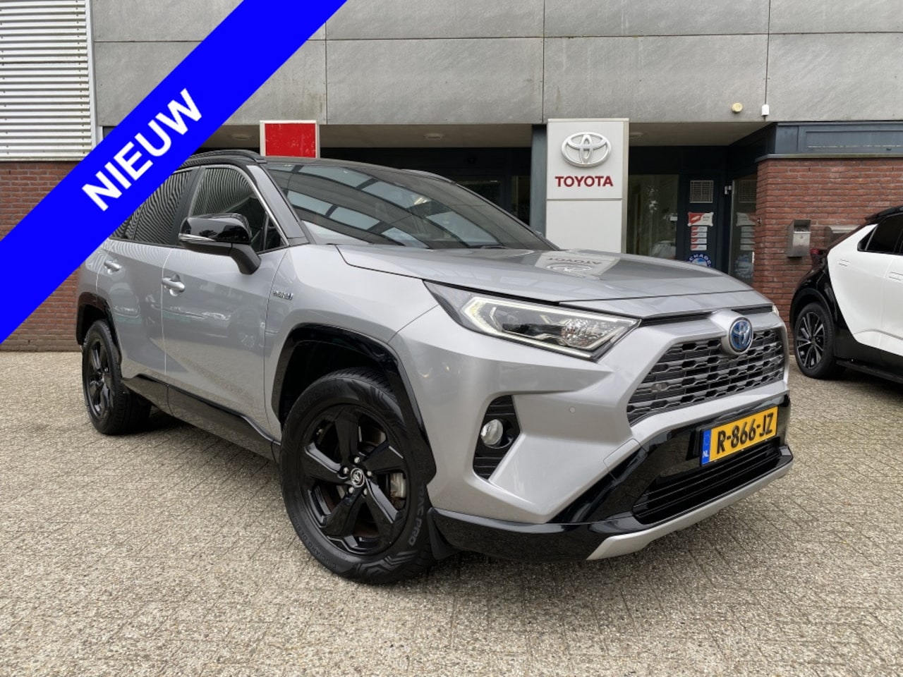 Toyota RAV4 - 2.5 Hybrid AWD Bi-tone 1650kg trekken Sens v+a Nav Apple/Android - AutoWereld.nl