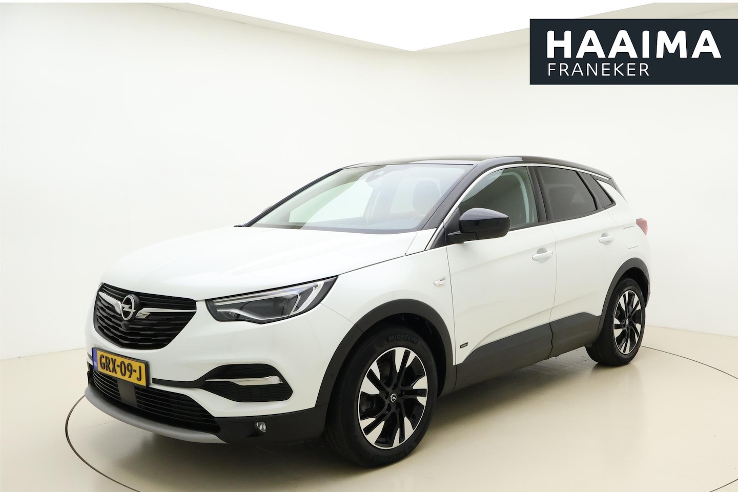 Opel Grandland X - 1.6 Turbo Hybrid4 Elegance 300 PK | Navigatie | Keyless | 36 Camera | Zwart dak | Electris - AutoWereld.nl