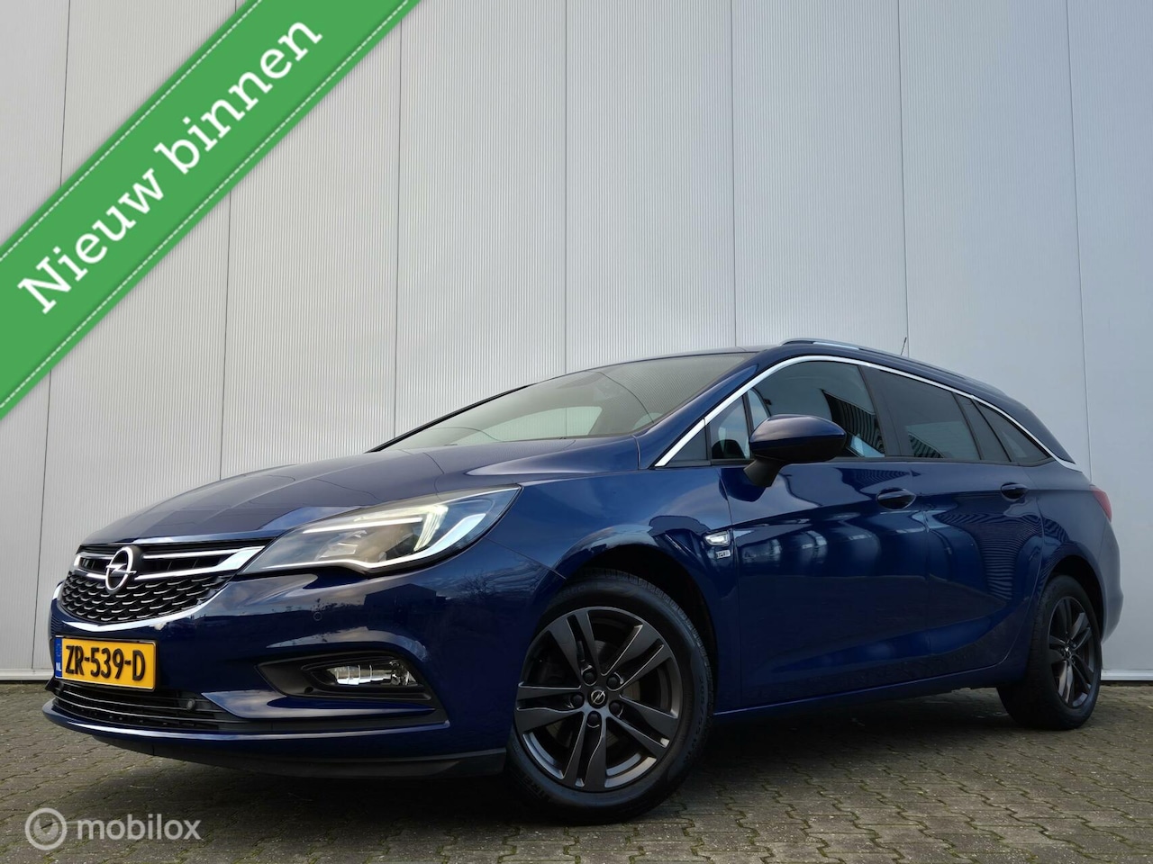 Opel Astra Sports Tourer - 1.0 TURBO 120 JAAR/CARPLAY/CLIMATE/PDC/16''LMV/LED - AutoWereld.nl