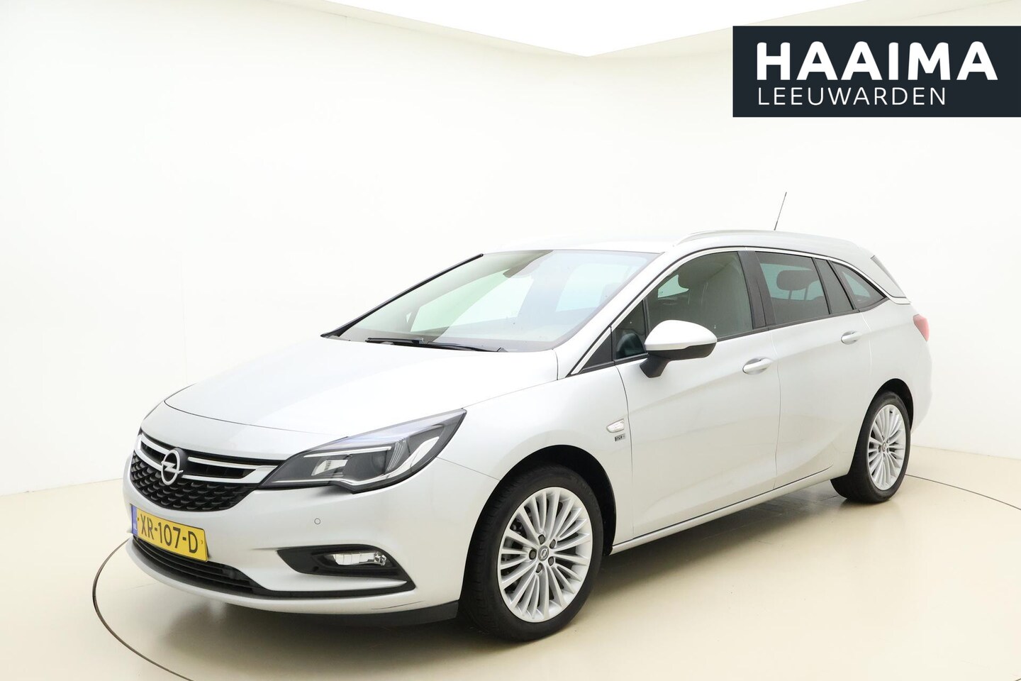 Opel Astra Sports Tourer - 1.4 Turbo 120 Jaar Edition 150 PK | Navigatie | Trekhaak | Climate control | Lichtmetalen - AutoWereld.nl