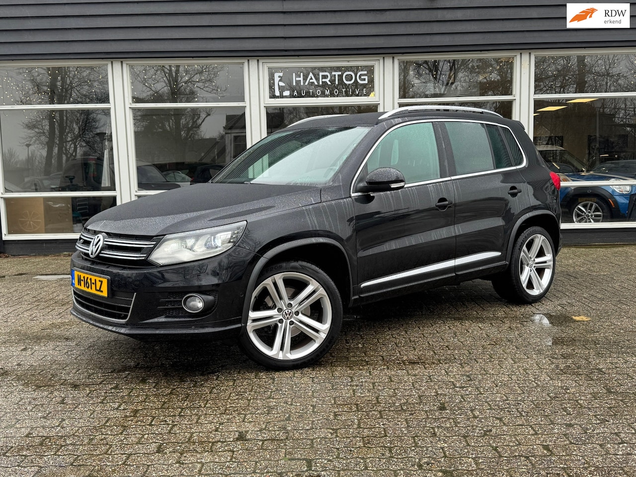 Volkswagen Tiguan - 2.0 TDI Sport&Style | R-Line | Navi | Clima | Xenon | - AutoWereld.nl