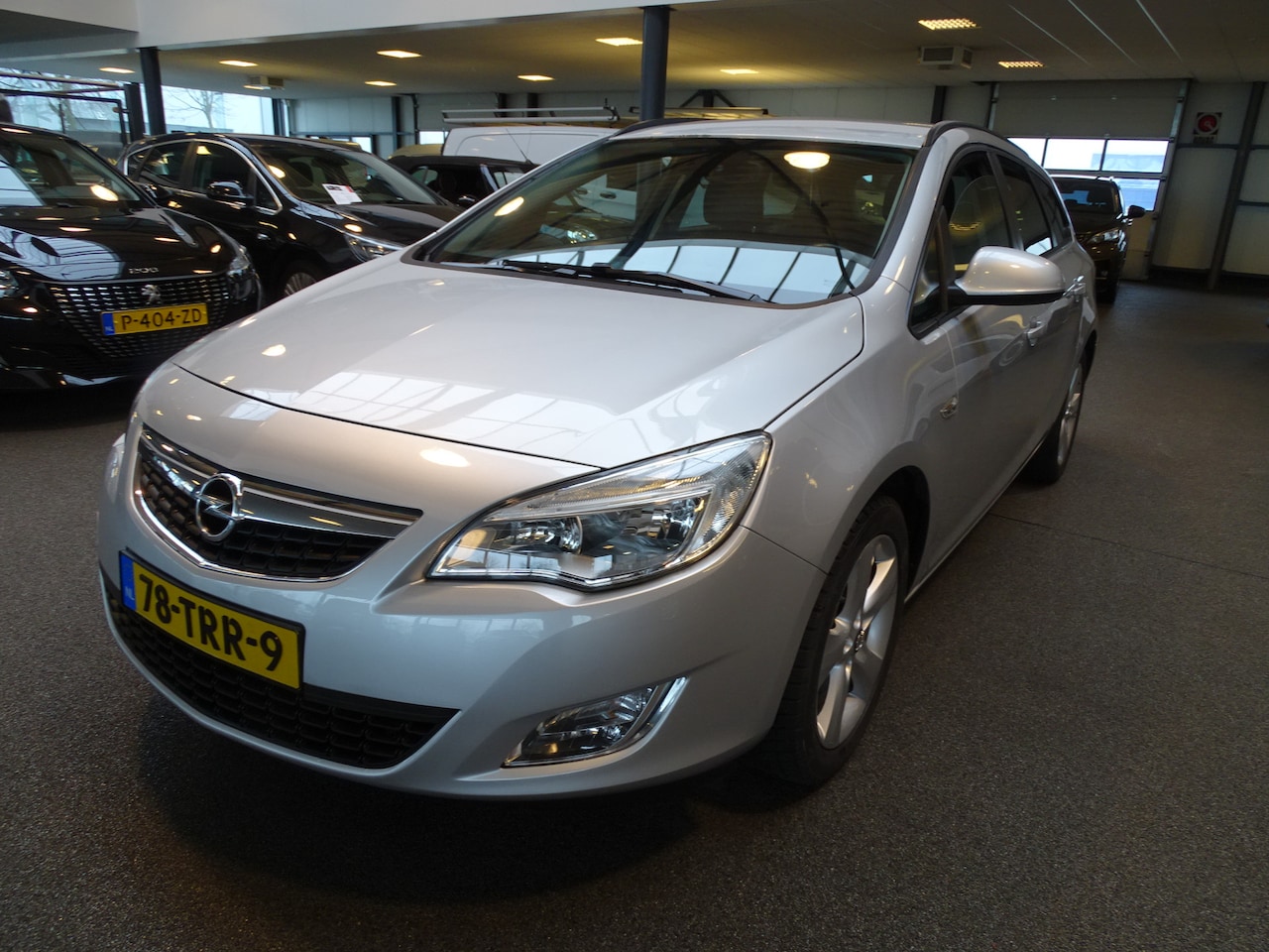 Opel Astra Sports Tourer - 1.4 Turbo Edition Trekhaak, Airco, Cruise, Navi, Etc. - AutoWereld.nl