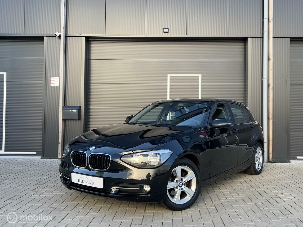 BMW 1-serie - 116i Business+ Stoelverwarming | Airco | Aux - AutoWereld.nl