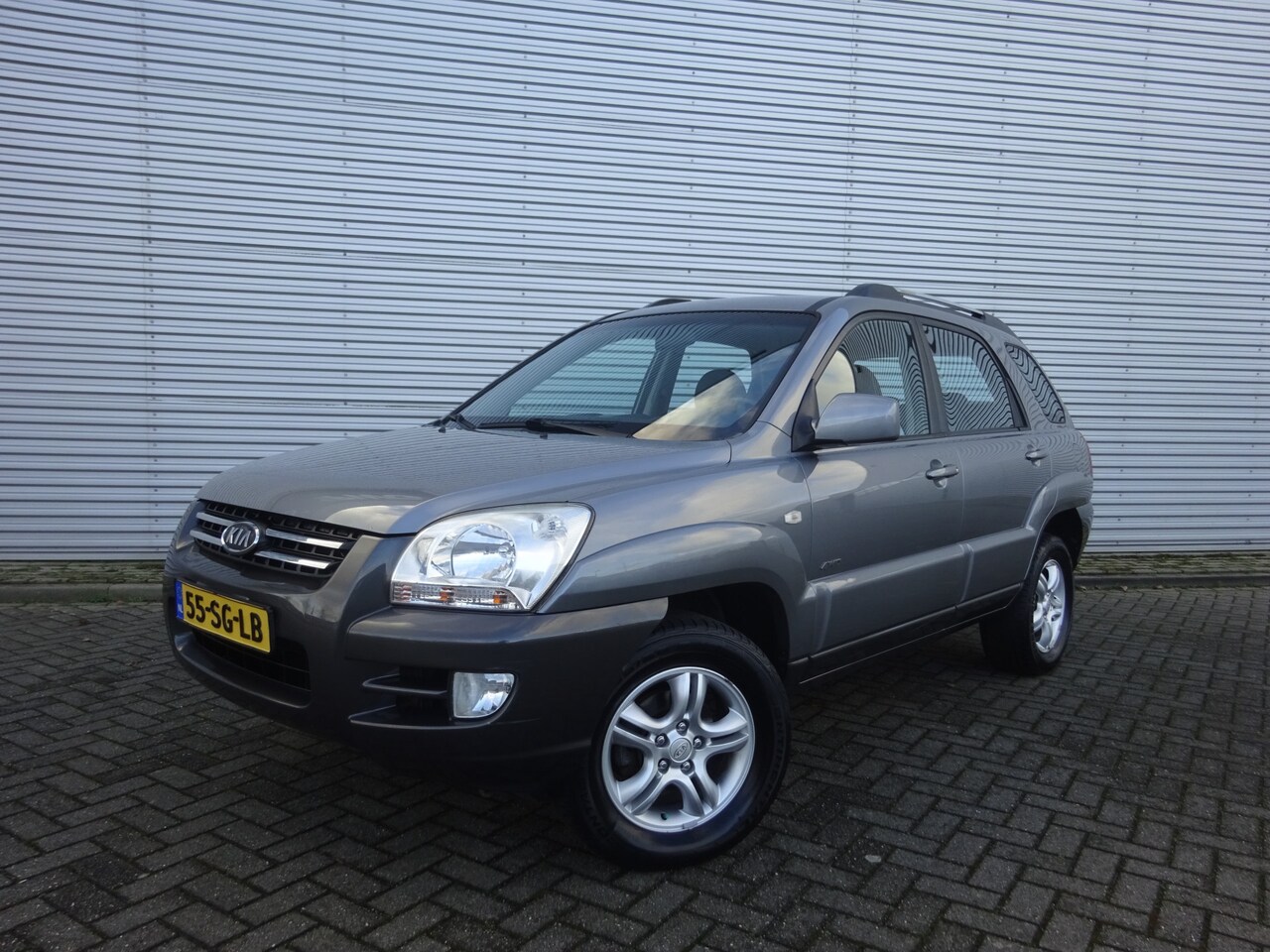 Kia Sportage - 2.0 CVVT Comfort - 4WD 1e Eigenaar / Airco / Elektr. ramen / Cruise control / NAP - AutoWereld.nl