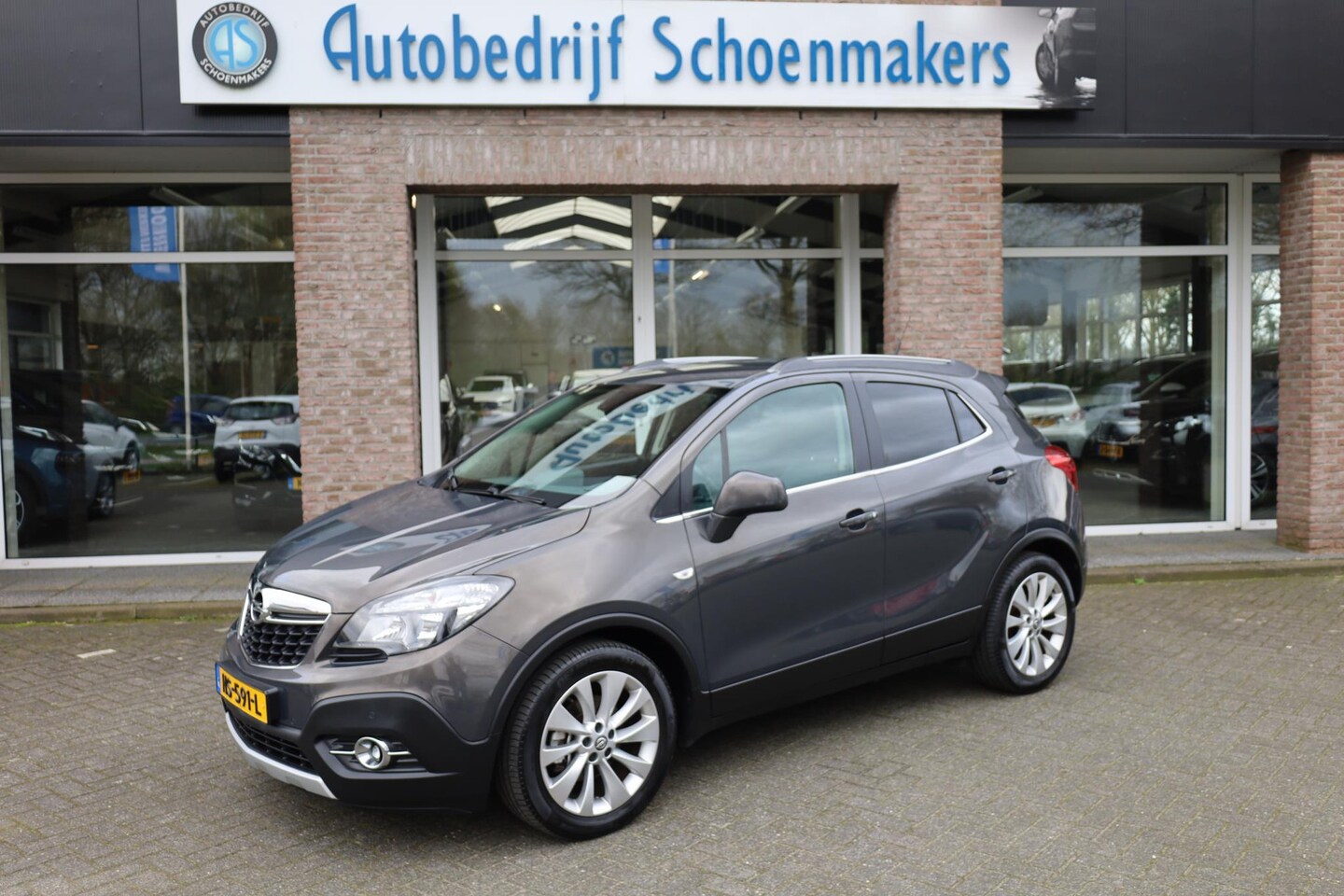 Opel Mokka - 1.4 T Cosmo CAMERA TREKHAAK NAVI 2xPDC HALFLEER 18"LMV CRUISE CLIMA - AutoWereld.nl