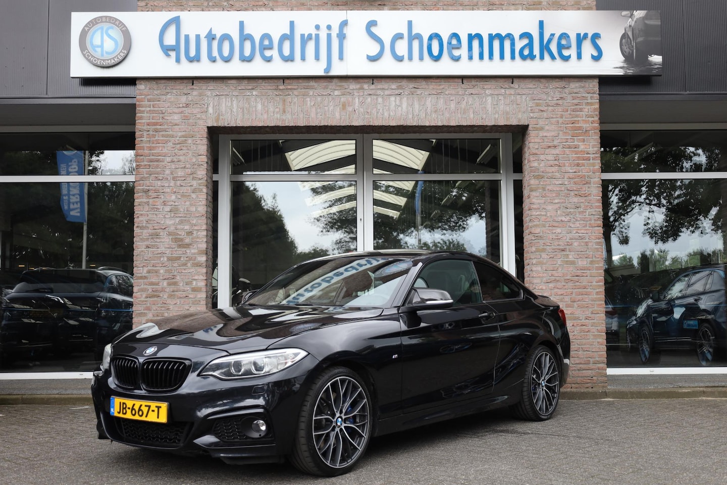 BMW 2-serie Coupé - 228i High Executive LEER WIDESCREEN NAVI PDC CRUISE CLIMA STOELVERWARMING ZWARTE-HEMEL - AutoWereld.nl