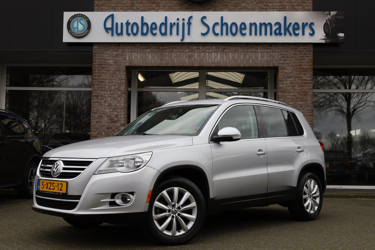 Volkswagen Tiguan - 2.0 TSI Sport&Style 4Motion TREKHAAK AUTOMAAT CRUISE AIRCO BT LEDER 2x STOELVERW. 17"LMV A - AutoWereld.nl