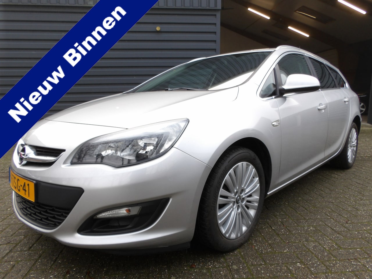 Opel Astra Sports Tourer - 1.4 Turbo Berlin Cruise Control Airco Trekhaak - AutoWereld.nl