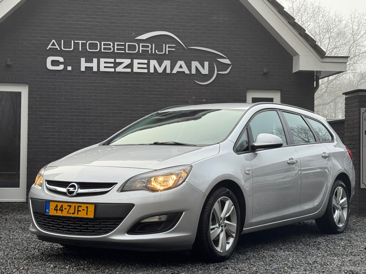 Opel Astra Sports Tourer - 1.4 Cosmo Navigatie Cruise & Climate Control N APK Sportvelgen - AutoWereld.nl