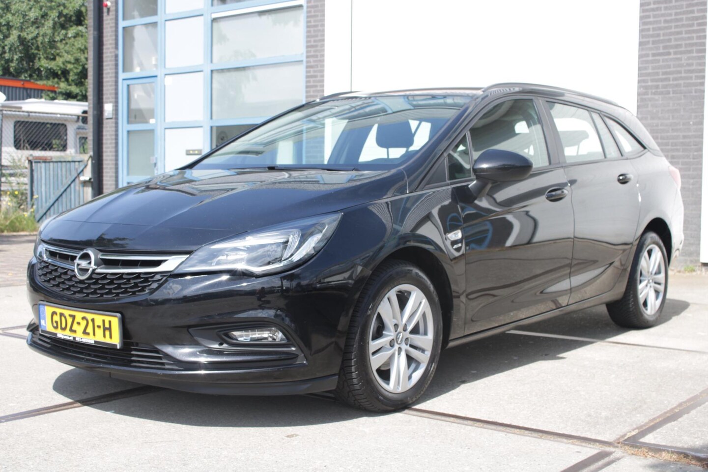 Opel Astra Sports Tourer - 1.4 Turbo S/S/ Airco / Carplay / Parkeersensoren / Navi / Cruise - AutoWereld.nl