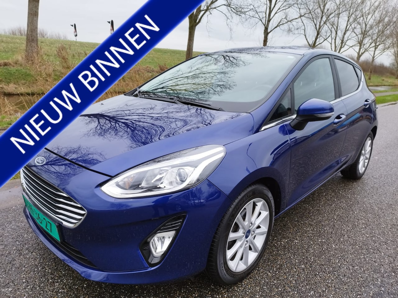 Ford Fiesta - 1.0 EcoBoost Titanium ** 125 PK ** NAVI ** PDC ** Bluetooth ** Stoelverwarming ** - AutoWereld.nl