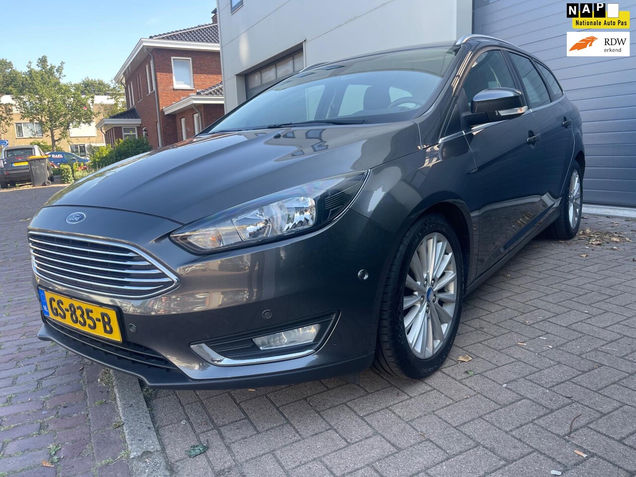 Ford Focus Wagon - 1.0 Titanium/Navi/Cruise-c/Climate-c/Park Assist/keyless/PDC/AUX/Dealer-onderhouden - AutoWereld.nl