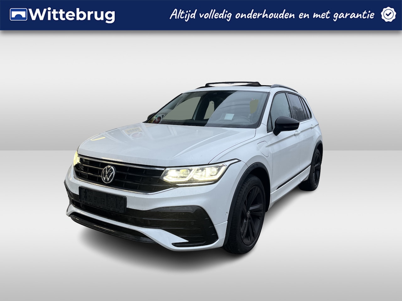 Volkswagen Tiguan - 1.4 TSI eHybrid 2x R-Line / AUTOMAAT/ TREKHAAK/ PANO/ CAMERA/ PARK. SENSOREN/ LEDEREN MEMO - AutoWereld.nl