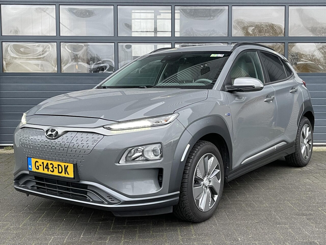 Hyundai Kona Electric - EV FASHION 64 KWH I APPLE/ANDROID I PARKEERCAMERA I CLIMATE CONTROL I CRUISE CONTROL - AutoWereld.nl