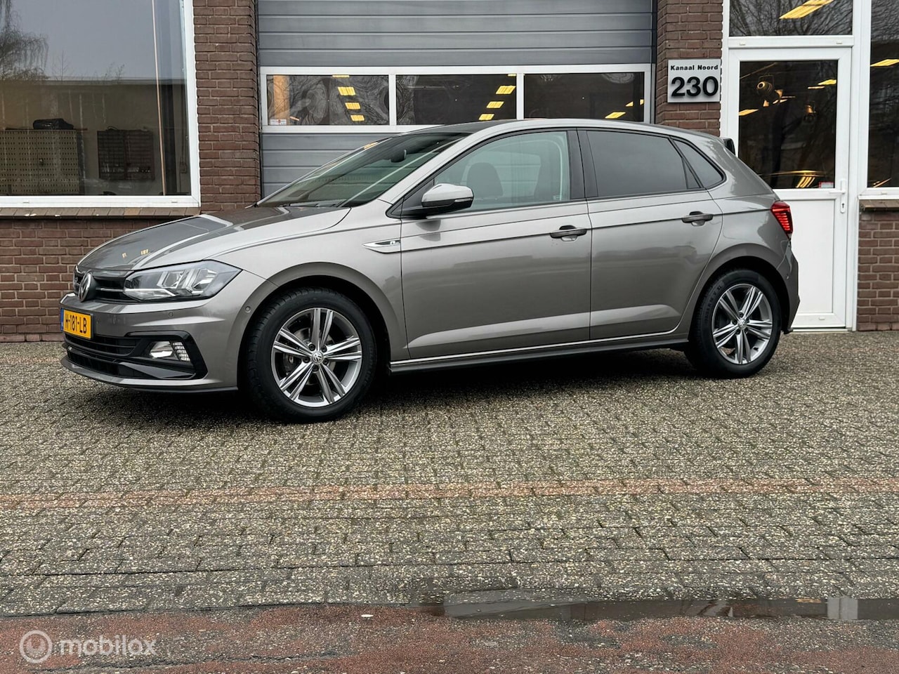 Volkswagen Polo - 1.0 TSI R LINE DIGITELLER/NAVI/ECC-AIRCO - AutoWereld.nl