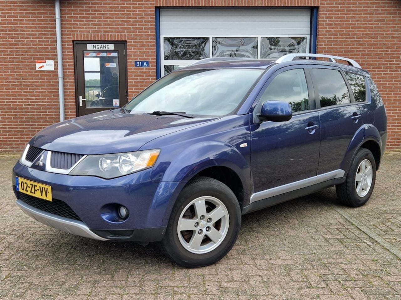 Mitsubishi Outlander - 2.4i Intro Edition 2WD Airco Clima NL-auto Trekhaak - AutoWereld.nl