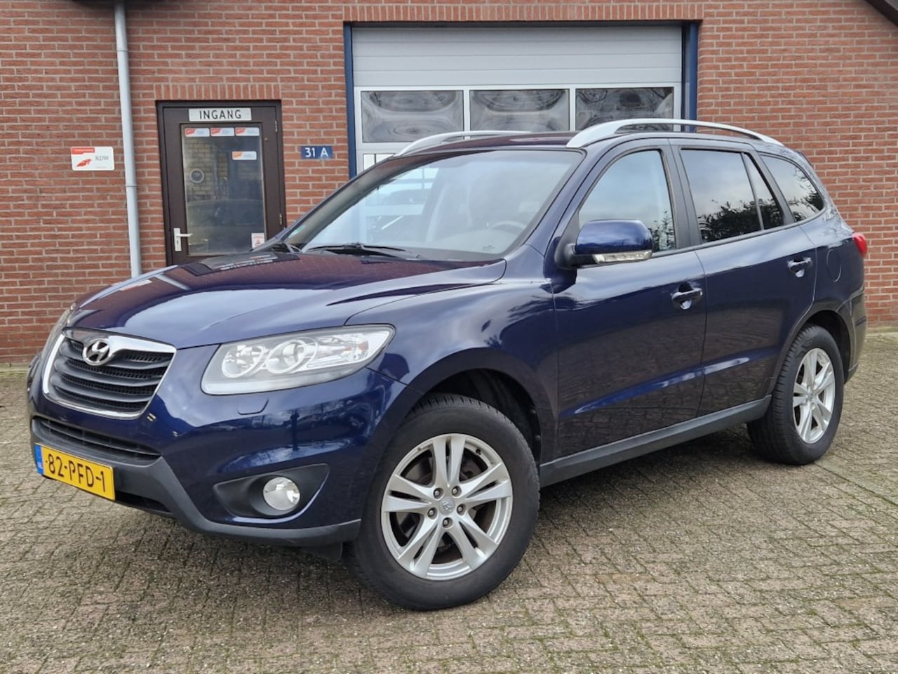 Hyundai Santa Fe - 2.4i CVVT 2WD Business Edition NL-auto Clima Cruise Trekhaak - AutoWereld.nl